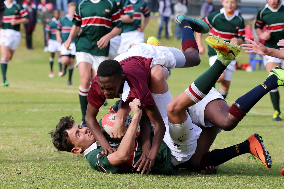 Group of Men Playing Rugby