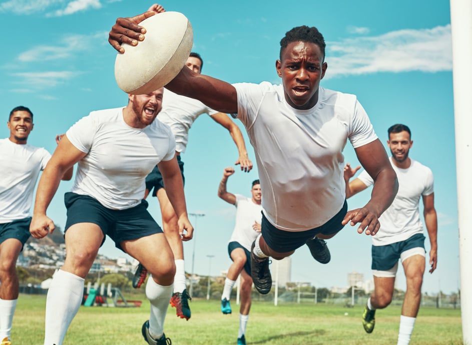 This Is for My Team. Shot of a Rugby Player Scoring a Try While